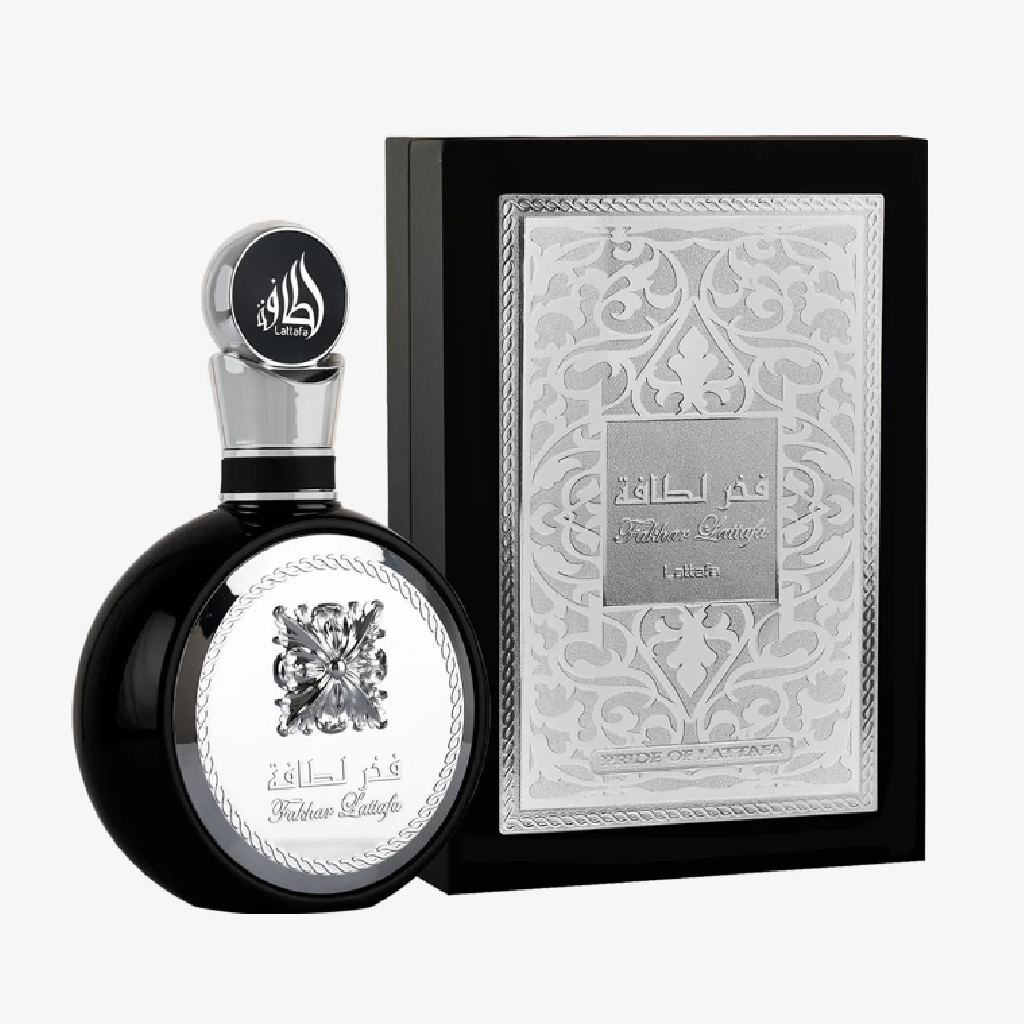 Lattafa Fakhar Black Perfume bottle with silver cap and decorative packaging on a white background